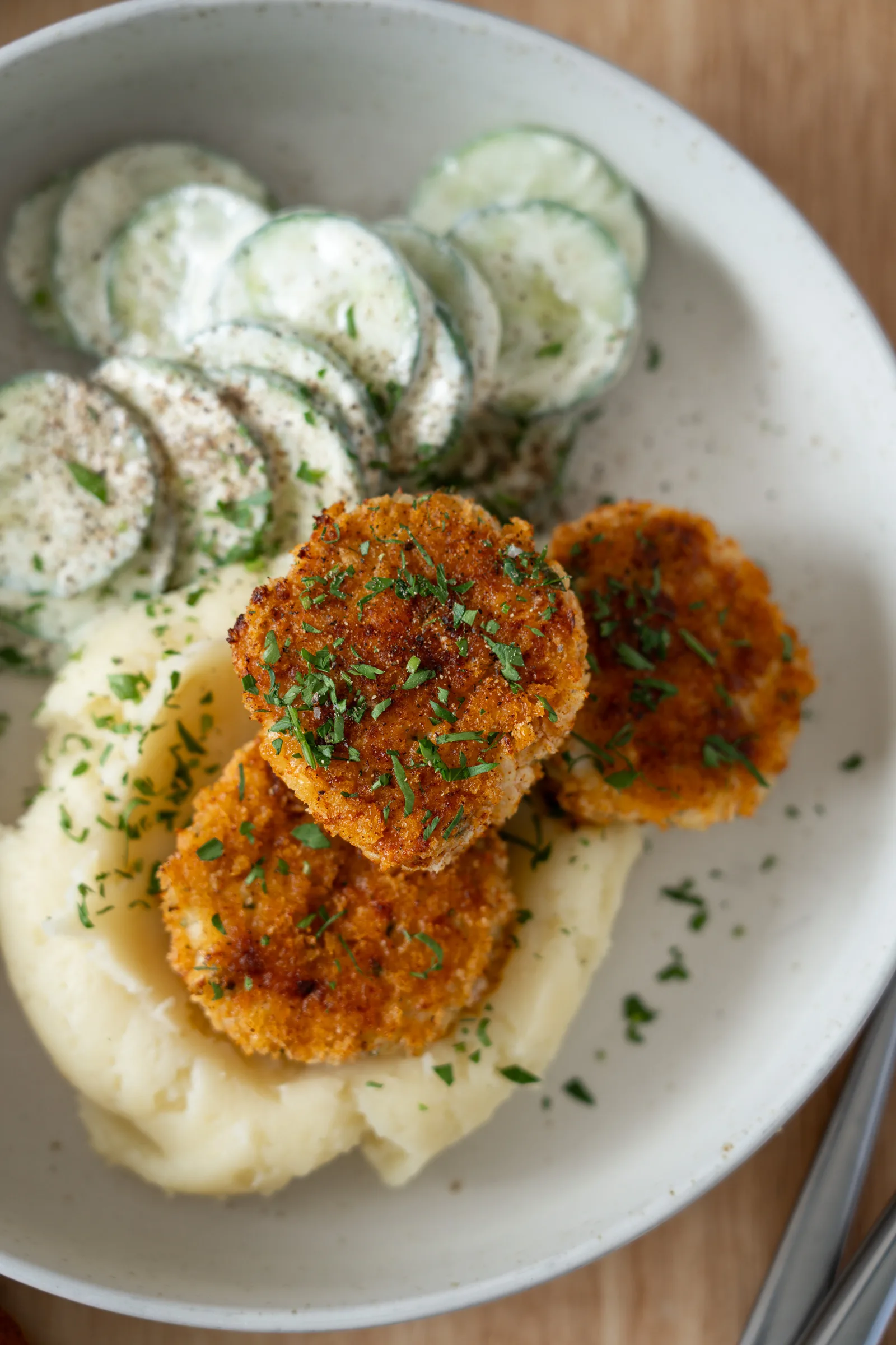 plated chicken rissoles close up overhead
