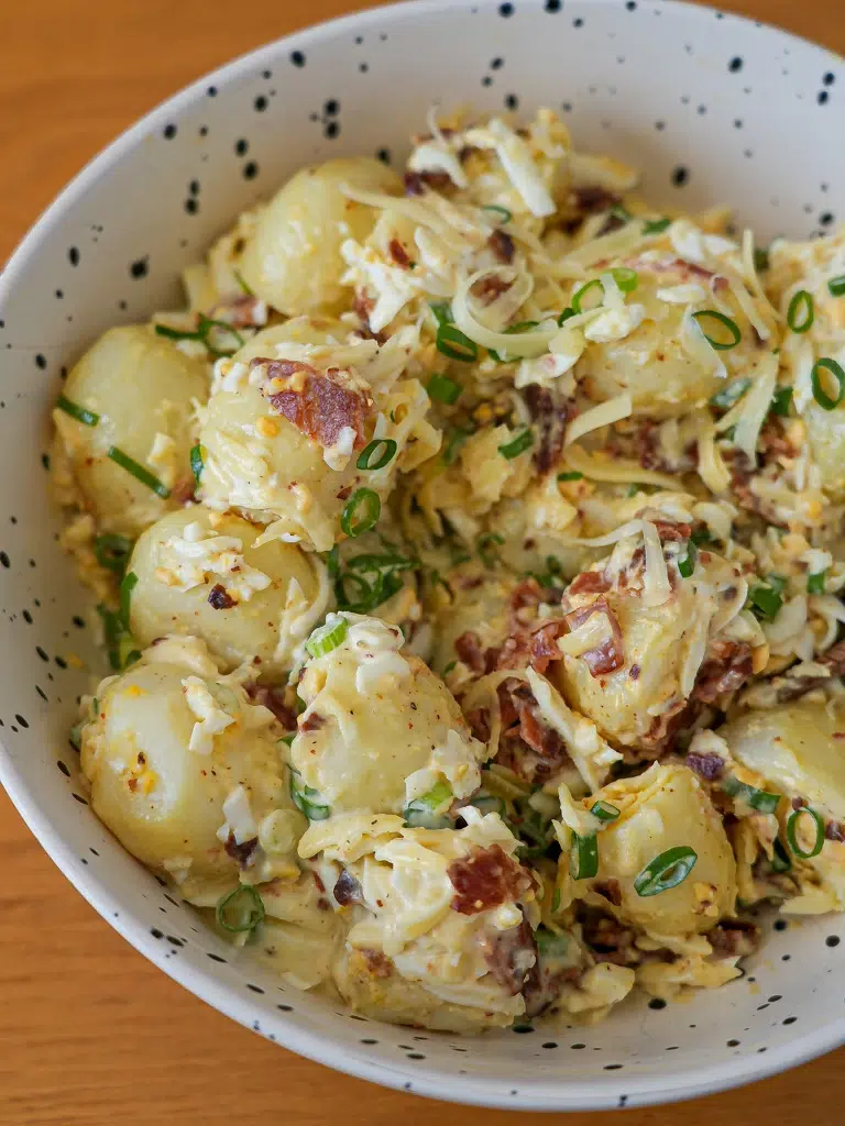 Close-up of ultimate loaded potato salad in a bowl